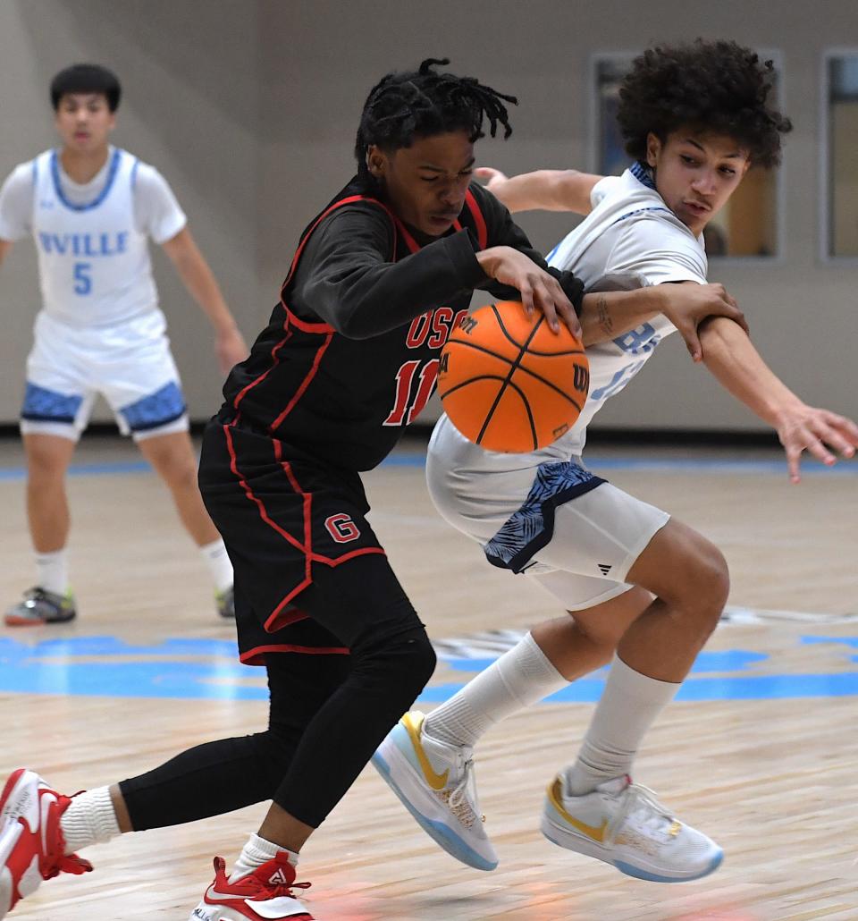 Bartlesville High School's Trae Collins (11) goes after the ball during basketball action against U.S. Grant in Bartlesville on Jan. 26, 2024.