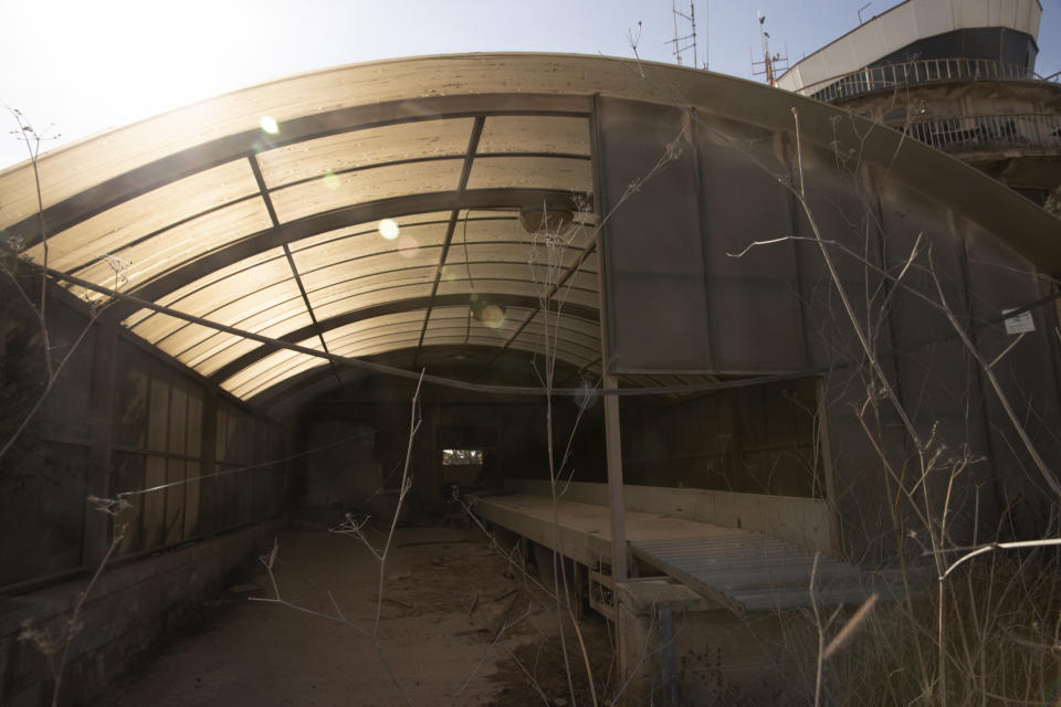 Cobwebs hang across the disused Atarot Airport, in Jerusalem Wednesday, Nov. 24, 2021. Israel is moving ahead with plans to build a massive Jewish settlement on the site of the long-abandoned airport that the Palestinians had hoped would one day service their future capital in east Jerusalem. (AP Photo/Maya Alleruzzo)