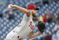 Philadelphia Phillies starting pitcher Zack Wheeler throws to a Washington Nationals player during the first inning of a baseball game, Sunday, Oct. 2, 2022, in Washington. (AP Photo/Luis M. Alvarez)