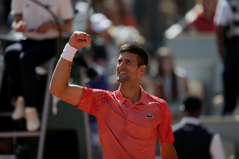 Serbia's Novak Djokovic celebrates after beating Peru's Juan Pablo Varillas in their fourth round match of the French Open tennis tournament at the Roland Garros stadium in Paris, Sunday, June 4, 2023. (AP Photo/Thibault Camus)