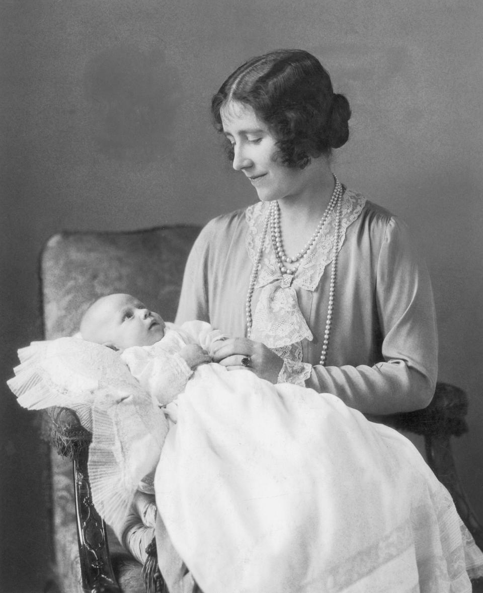 The Duke of York gave Lady Elizabeth Bowes-Lyon (aka Queen Elizabeth II’s mother, who later in life was referred to as the Queen Mother or Queen Mum) a sapphire ring (which is something we’ll see given to Windsor brides again and again as we make our way down the family tree). The ring had diamond accents and was complemented by a Welsh gold wedding band. Eventually, she decided to swap out her engagement ring for a large pearl surrounded by diamonds.