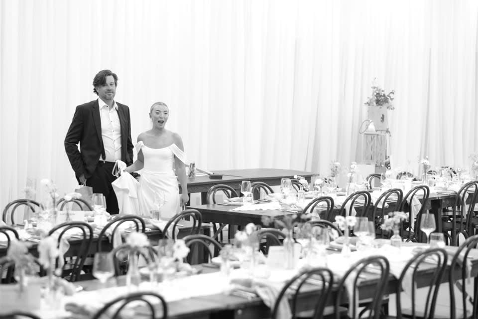 Faced with an incoming storm, Brittany Schnare and Drew Mitchell moved their outdoor wedding to a nearby fish plant. (Rob and Katie Decoeli - image credit)