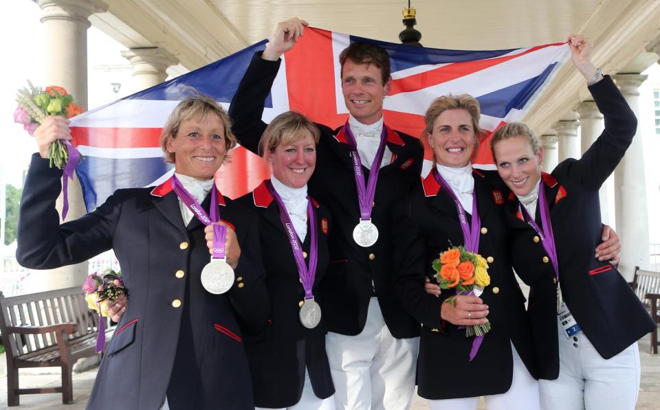 Zara Phillips (right) celebrating with the team after finishing second in the Team Eventing at the London Olympic Games