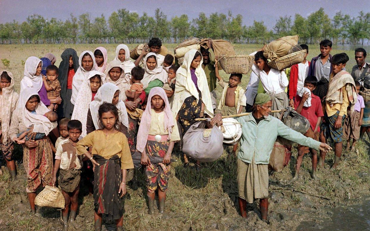 Burmese Muslims fleeing the military government arrive in Dhaka, Banglades - AP