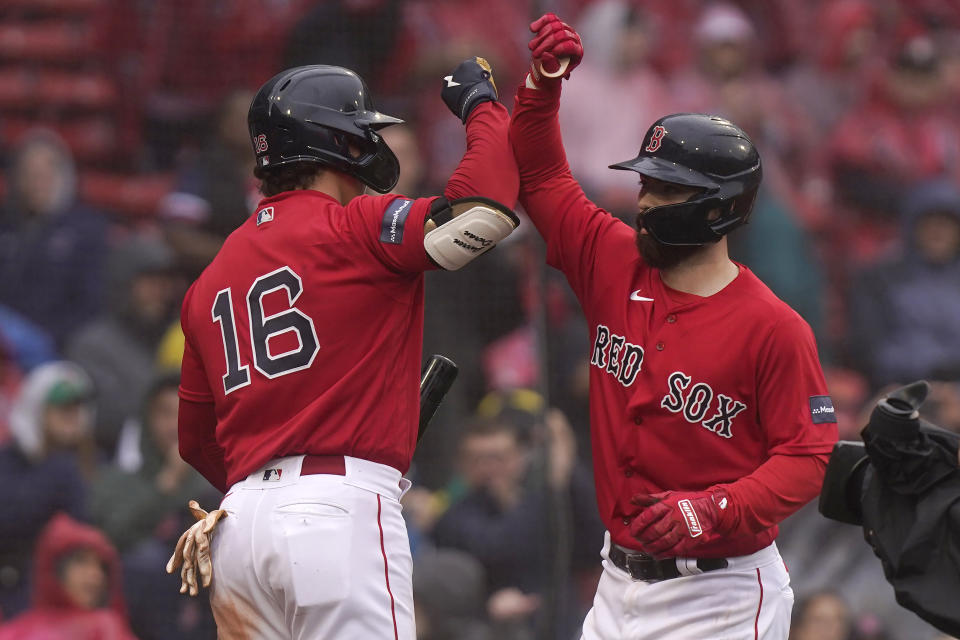 Boston Red Sox's Jarren Duran (16) celebrates with Connor Wong, right, as Wong arrives at home after hitting a two-run home run off a pitch by Cleveland Guardians' Nick Sandlin in the sixth inning of a baseball game, Sunday, April 30, 2023, in Boston. (AP Photo/Steven Senne)