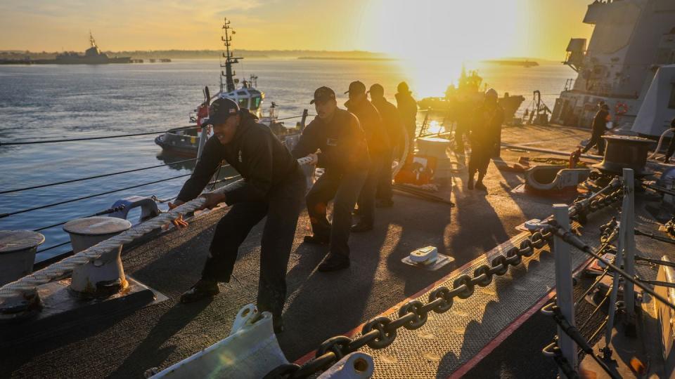 Sailors heave around mooring line during a sea and anchor evolution aboard the Navy destroyer Bulkeley in February. (Mass Communication Specialist 3rd Class Joseph Macklin/Navy)