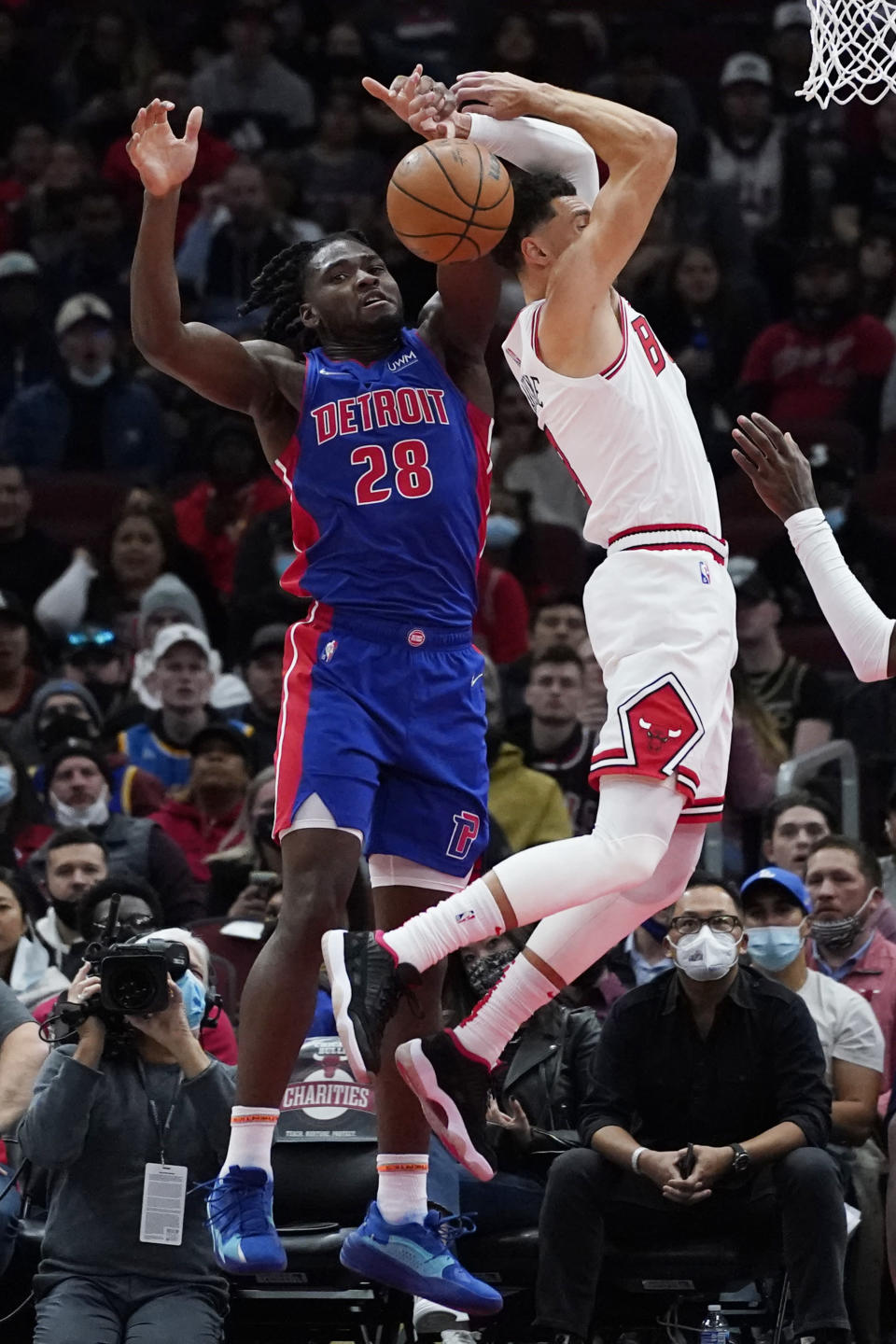 Detroit Pistons center Isaiah Stewart, left, blocks a shot by Chicago Bulls guard Zach LaVine during the first half of an NBA basketball game in Chicago, Saturday, Oct. 23, 2021. (AP Photo/Nam Y. Huh)