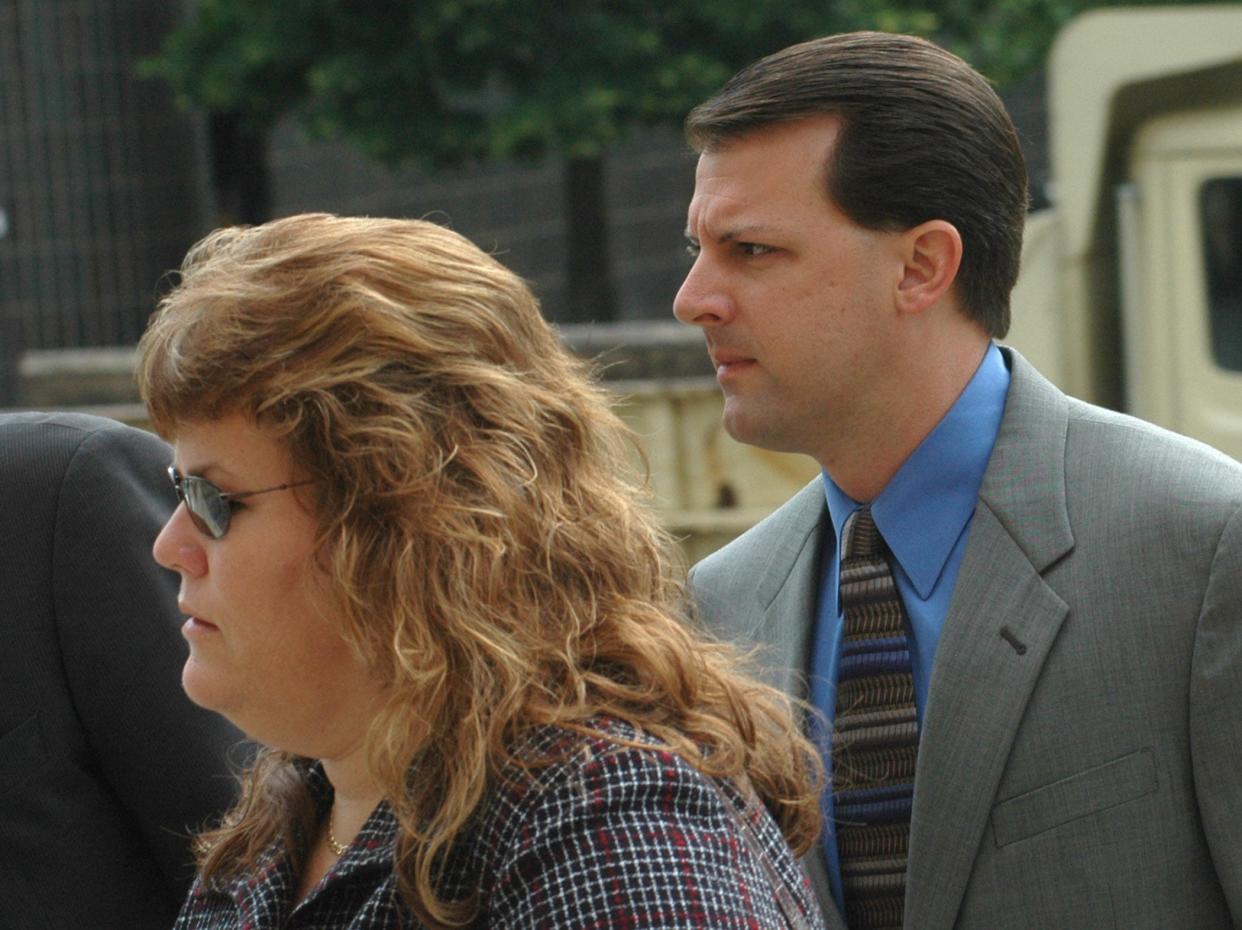 Jeff Pelley, with his wife Kim, enters the St. Joseph County courthouse during his 2006 trial. He was convicted of murdering his father, stepmother and two stepsisters in 1989.