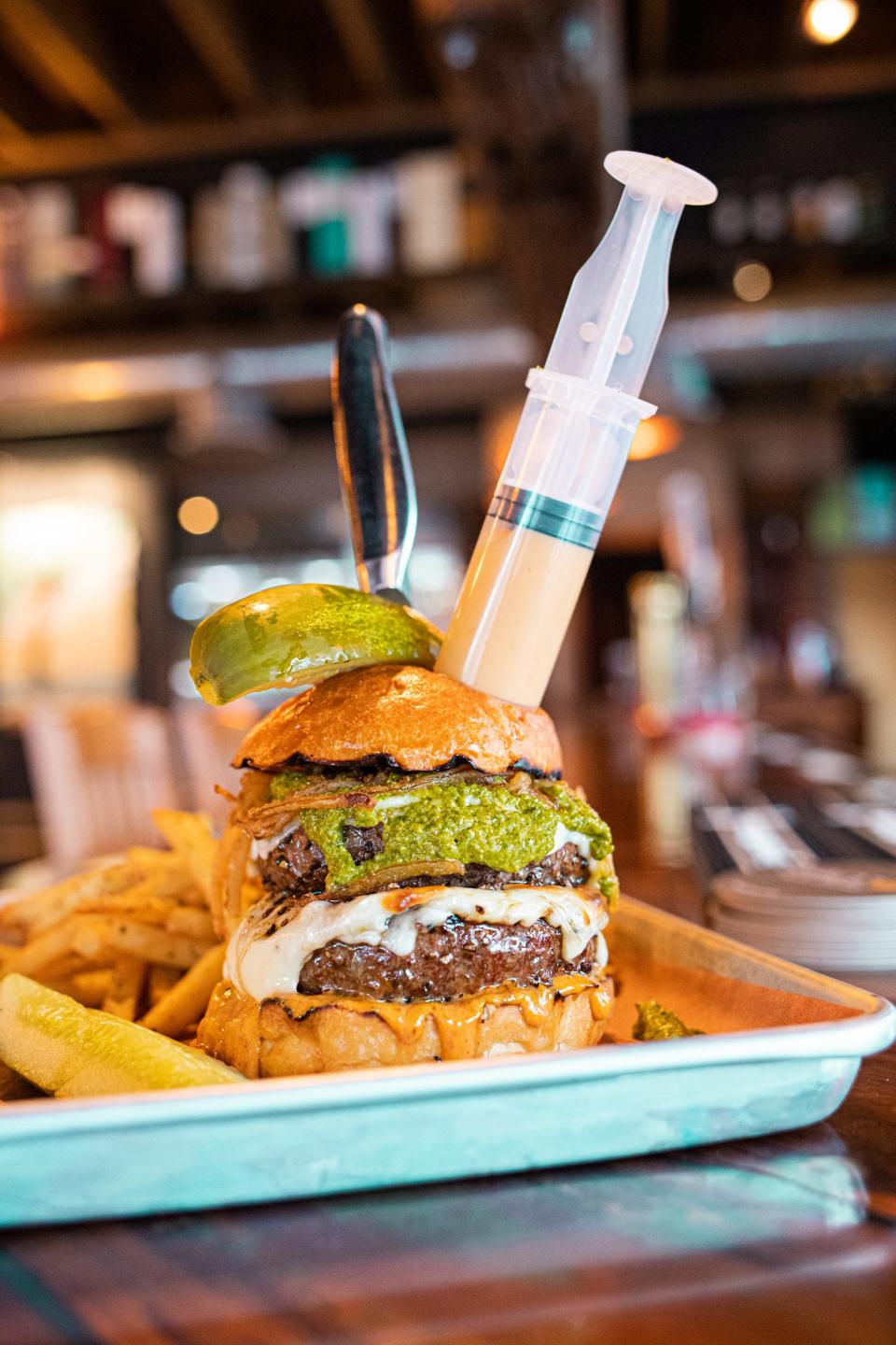The Fifth Element's entry into the Newport Burger Bender features a diner-controlled spicy blend of queso fuego, a chili-infused cheese sauce. Want to enjoy more heat, inject more of the sauce.