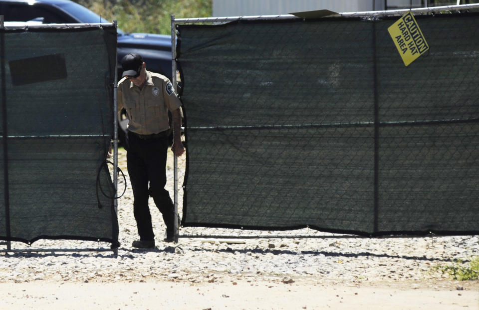 A security guard closes a gate at the construction site of a new clinic that is being built by Planned Parenthood in Birmingham, Ala., on Thursday, June 13, 2019. The organization is working on the project despite a new state law that virtually bans abortion in Alabama. (AP Photo/Jay Reeves)