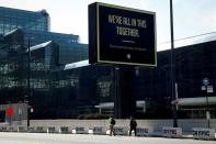 FILE PHOTO: A sign displays a message outside the Jacob K. Javits Convention Center which is being partially converted into a temporary hospital in Manhattan during the outbreak of the coronavirus disease (COVID-19) in New York
