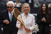 Martina Navratilova, the 18-time Grand Slam singles champion and member of the International Tennis Hall of Fame, holds the Racchetta d'Oro (Golden Racket) award she received from the Italian Tennis Federation before the men's final tennis match at the Italian Open tennis tournament in Rome, Italy, Sunday, May 21, 2023. Former Italian tennis player Nicola Pietrangeli stands at left. (AP Photo/Alessandra Tarantino)