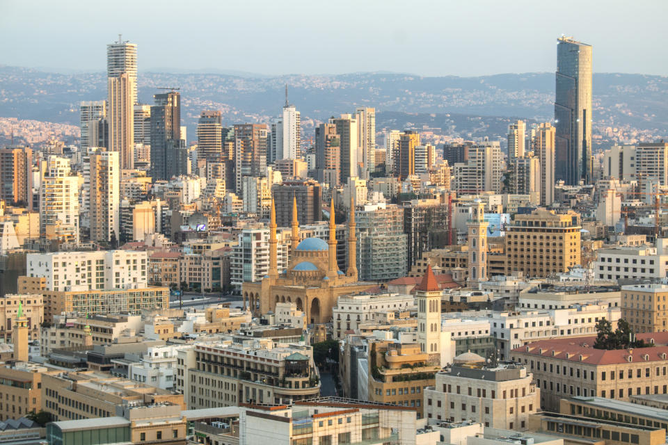 View on Beirut, Lebanon, with skyscrapers, mosques and churches. The big mosque is the Mohammad Al-Amin Mosque, also called here the Blue mosque. It was built from 2002-2008. Adjacent to the mosque is the St. George Maronite Cathedral with the new bell tower.