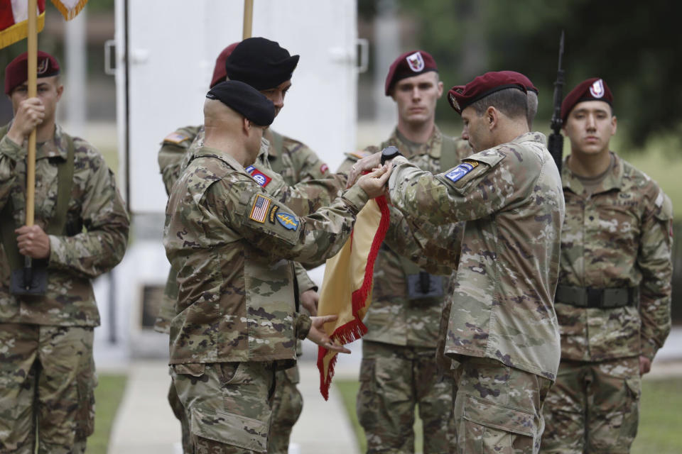 Lieutenant General Christopher T. Donahue, right, takes part of the Casing of the Colors during a ceremony to rename Fort Bragg on Friday, June 2, 2023 in Fort Bragg, N.C. The U.S. Army changed Fort Bragg to Fort Liberty as part of a broader initiative to remove Confederate names from bases. (AP Photo/Karl B DeBlaker)