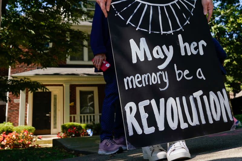 Protesters gather outside the home of US Senate Majority Leader Mitch McConnel in Louisville