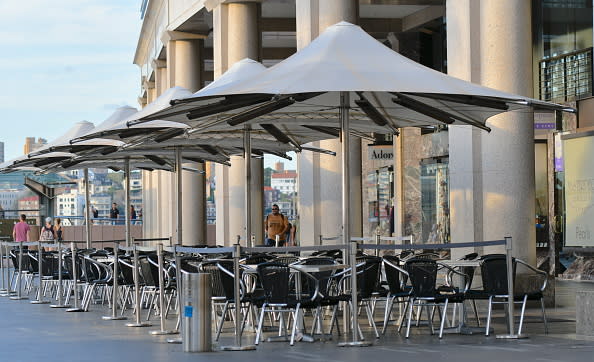 A empty restaurant tables is seen at Circular Quay in Sydney.