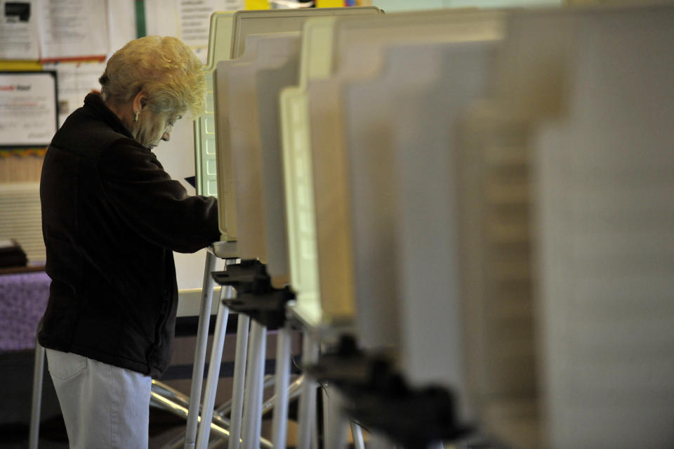 Joanne Senese votes at Galewood Community Church in the state's primary election Tuesday, March 18, 2014, in Chicago.(AP Photo/Paul Beaty)