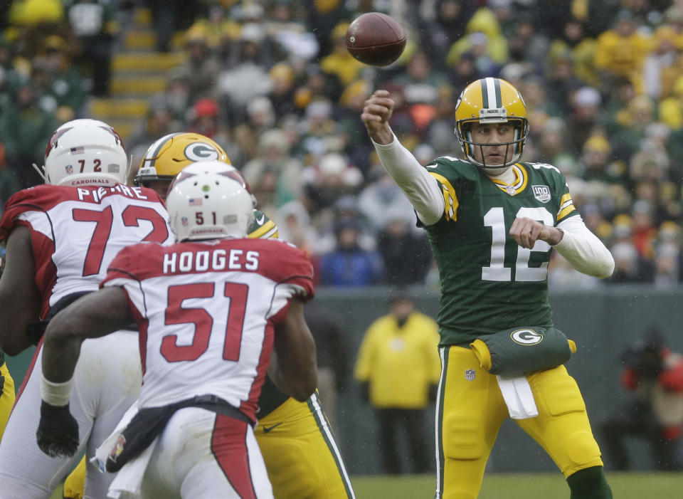 Green Bay Packers quarterback Aaron Rodgers throws a pass during the first half of an NFL football game against the Arizona Cardinals Sunday, Dec. 2, 2018, in Green Bay, Wis. (AP Photo/Mike Roemer)