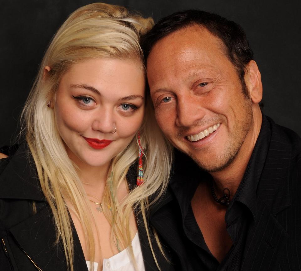 Elle King (L) and her father, comedian Rob Schneider pose at The Ice House Comedy Club on October 15, 2009 in Pasadena, California