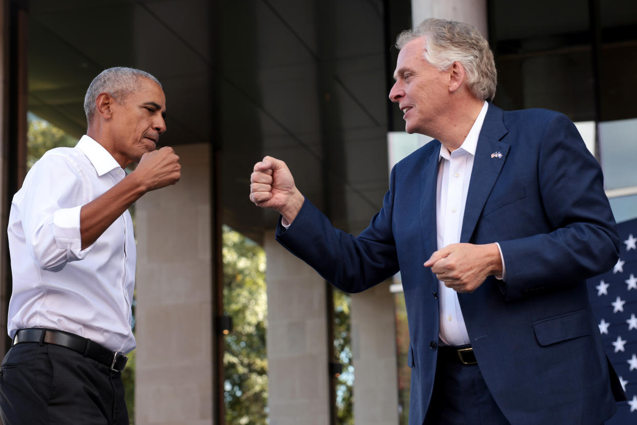 Barack Obama fist bumps with Terry McAuliffe.