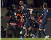 Paris St Germain's Edinson Cavani (L) reacts after scoring a goal with teammate Blaise Matuidi on his back during their Champions League round of 16 first leg soccer match against Chelsea at the Parc des Princes Stadium in Paris February 17, 2015. REUTERS/Christian Hartmann