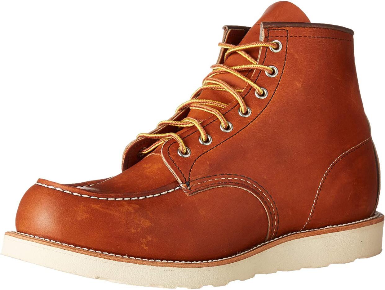 Red Wing Heritage tan boots with thick white sole.