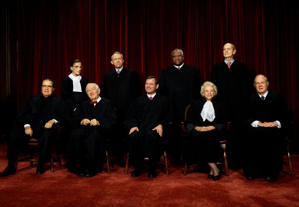 The justices of the U.S. Supreme Court gather for a group portrait at the Supreme Court Building in Washington, Monday, Oct. 31, 2005. Seated, from left: Antonin Scalia, John Paul Stevens, John G. Roberts Jr., Sandra Day O'Connor, and Anthony M. Kennedy. Standing, from left: Ruth Bader Ginsburg, David Souter, Clarence Thomas, and Stephen Breyer.