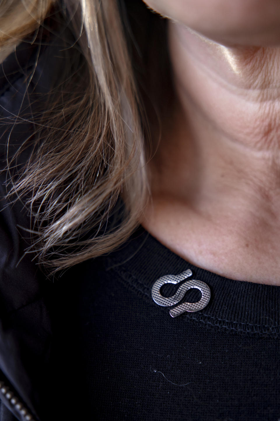 Karen Sandone wears an Alzheimer's Association pin. (Rachel Wisniewski for The Washington Post)