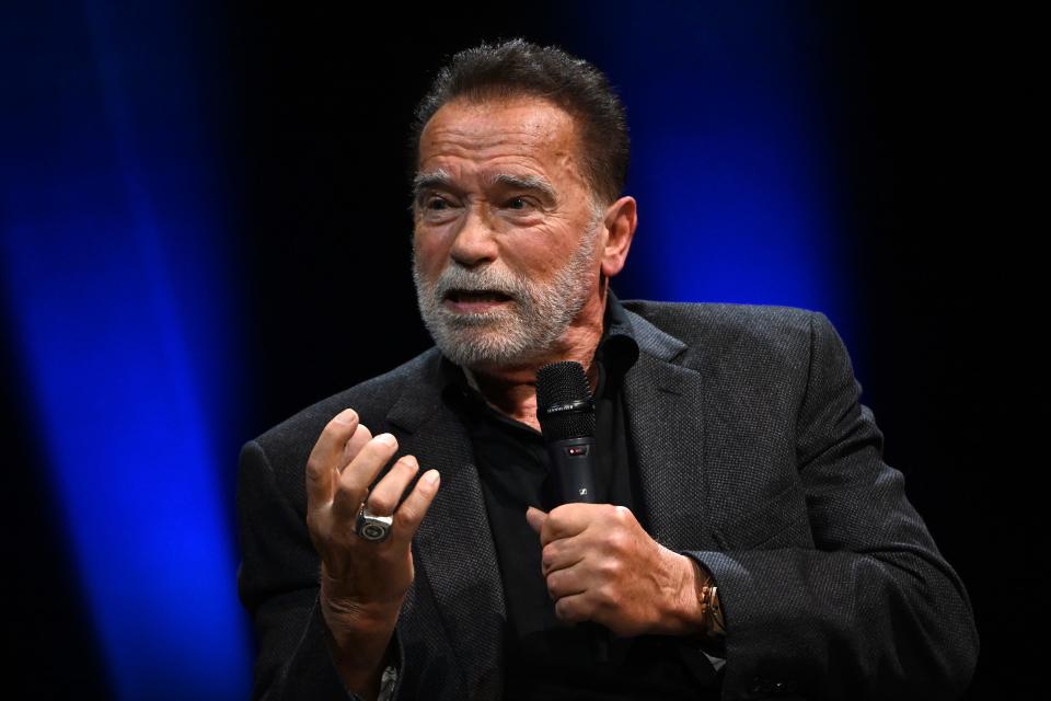 Arnold Schwarzenegger speaks onstage at an Evening with Arnold Schwarzenegger presented by Fane at London Palladium in London on Oct. 24, 2023.