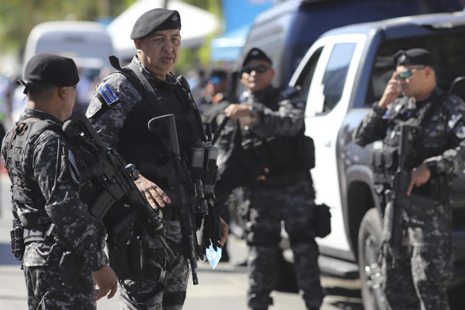 Police guard a polling station during the general election in San Salvador, El Salvador, Sunday, Feb. 4, 2024. (AP Photo/Salvador Melendez)