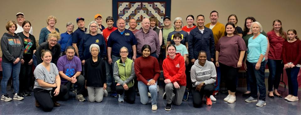 Volunteers who helped with the "No Cost Market" at Red Hook Community Center pose together.