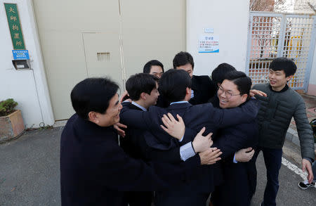 South Korean conscientious objectors celebrate after being released from Daegu detention center in Daegu, South Korea, November 30, 2018. Yonhap via REUTERS