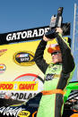 TALLADEGA, AL - OCTOBER 22: Mark Martin, driver of the #5 GoDaddy.com Chevrolet, celebrates setting the pole position in qualifying for the NASCAR Sprint Cup Series Good Sam Club 500 at Talladega Superspeedway on October 22, 2011 in Talladega, Alabama. (Photo by Jared C. Tilton/Getty Images for NASCAR)