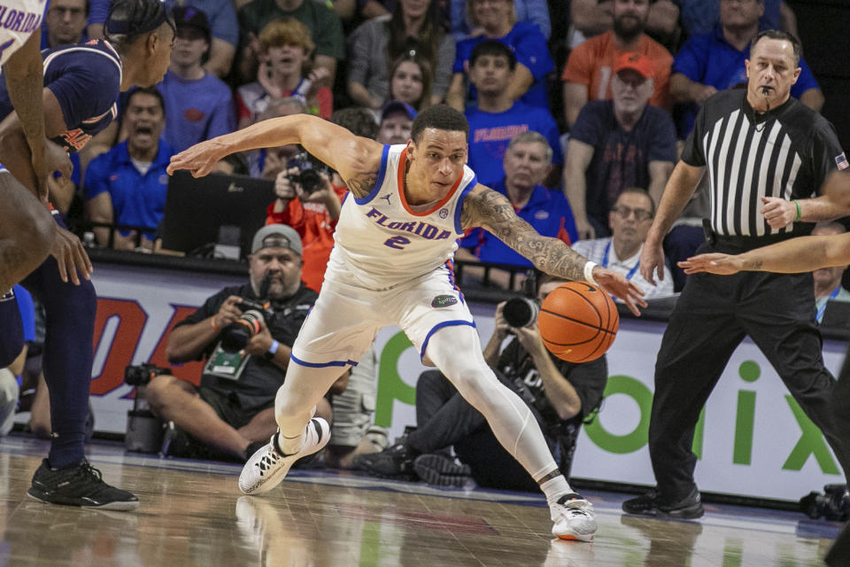 Florida guard Riley Kugel (2) grabs the loose ball during the first half of an NCAA college basketball game against Auburn Saturday, Feb. 10, 2024, in Gainesville, Fla. (AP Photo/Alan Youngblood)