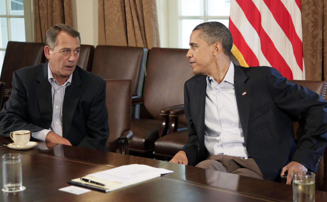 President Barack Obama meets with House Speaker John Boehner of Ohio, left, in the Cabinet Room of the White House, Saturday, July 23, 2011, in Washington, to discuss the debt. (AP Photo/Carolyn Kaster)