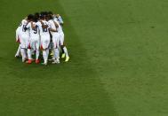 Costa Rica players huddle before kickoff during their 2014 World Cup quarter-finals against Netherlands at the Fonte Nova arena in Salvador July 5, 2014. REUTERS/Ruben Sprich