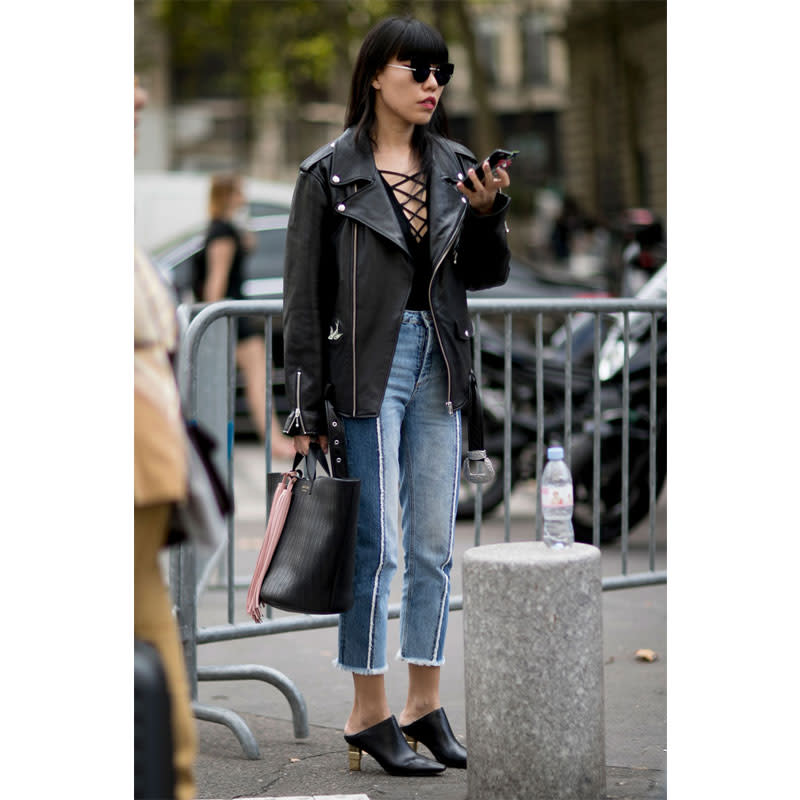 <p>Evening staples like a lace-up bodysuit, heels and a black leather jacket look less intimidating when worn with faded denim.</p>
