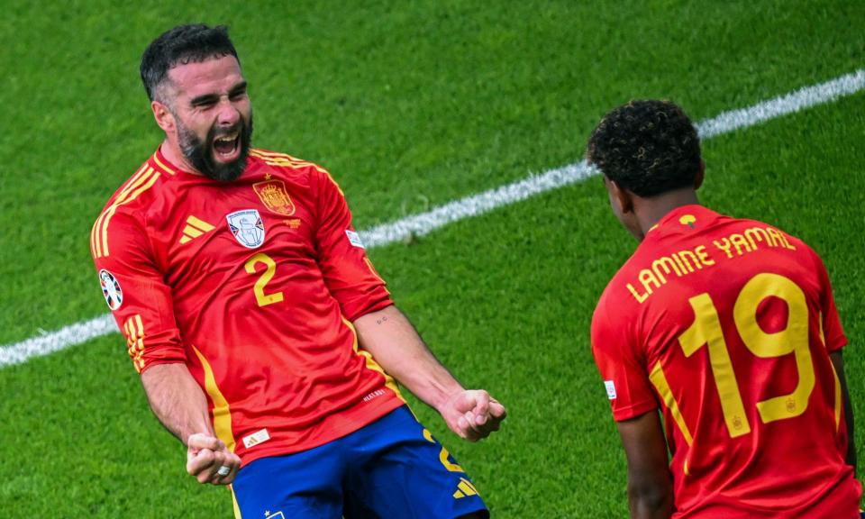 <span>Spain's Dani Carvajal (left) celebrates after scoring his side's third goal.</span><span>Photograph: Sebastian Christoph Gollnow/AP</span>