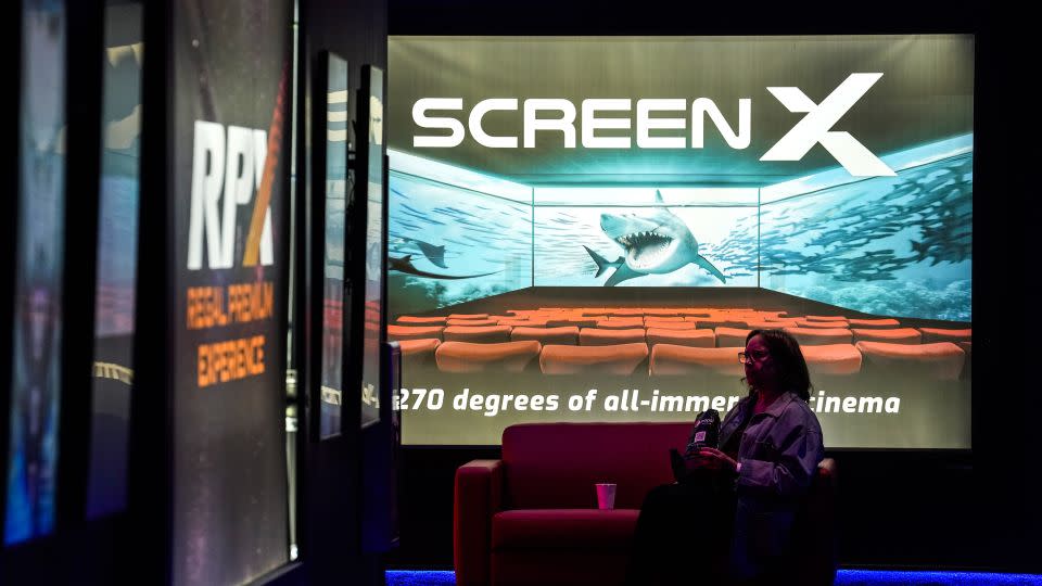 Screen X, a 270-degree moving screen, is advertised in the lobby at Regal MarqE Cinema, in Houston, Texas. - Brett Coomer/Houston Chronicle/Getty Images