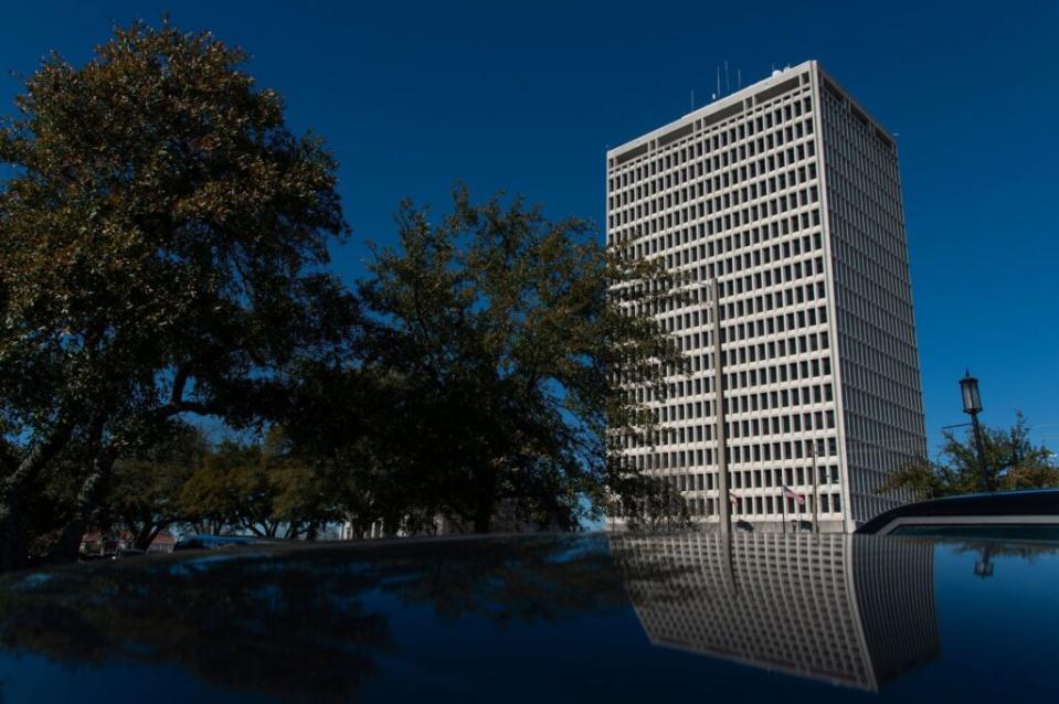 A tall building behind trees