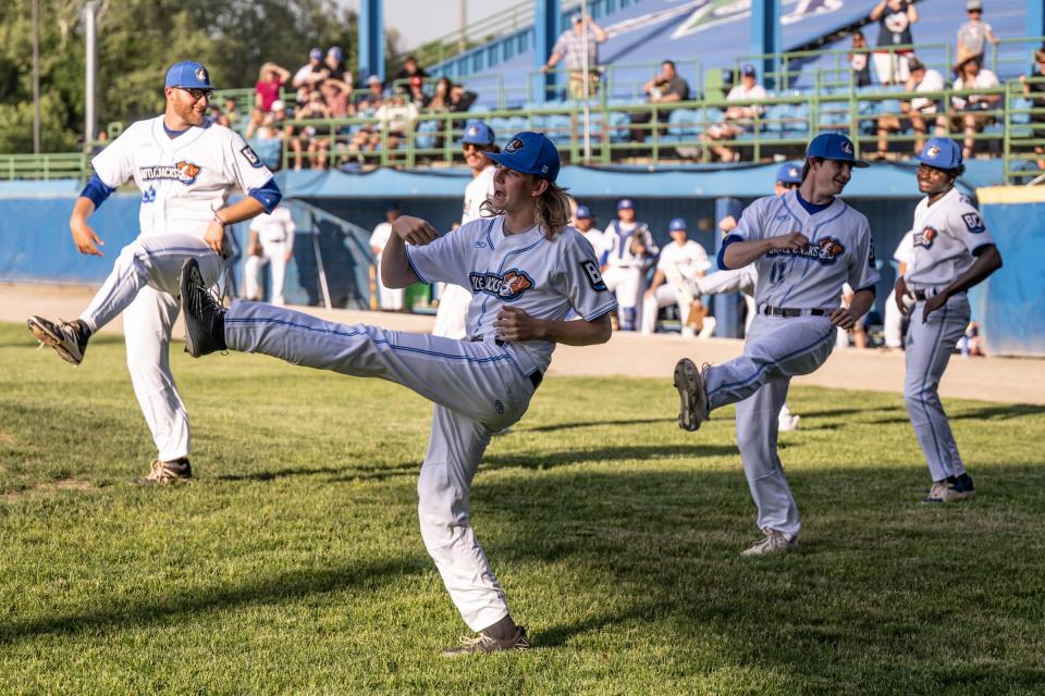 Some of the Battle Creek Battle Jacks players do a dance between innings during the Battle Jacks opening night at C.O. Brown Stadium on Monday, May 30, 2022