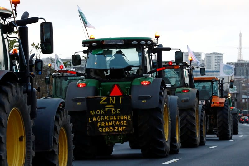 French farmers drive on the A6 motorway during a protest on their way to Paris