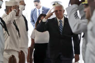 Vice President Mike Pence salutes as he boards the USNS Comfort, Tuesday, June 18, 2019, in Miami. The hospital ship is scheduled to embark on a five-month medical assistance mission to Latin America and the Caribbean, including several countries struggling to absorb migrants from crisis-wracked Venezuela. (AP Photo/Lynne Sladky)