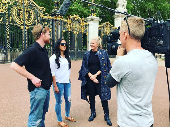 <p>Reporter Sam interviewed Prince harry and Meghan Markle lookalikes, wearing a coat designed by Rebecca Vallance.<br>Source: Instagram/sam_armytage </p>