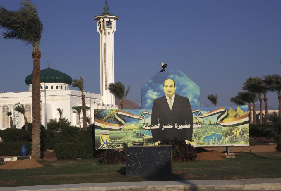 A billboard next to a mosque shows Egyptian President Abdel Fattah el-Sissi ahead of this year’s United Nations global summit on climate change, known as COP27, on Peace Road in Sharm el-Sheikh, South Sinai, Egypt, Thursday, Nov. 3, 2022. As this year’s United Nations climate summit approaches, Egypt’s government is touting its efforts to make Sharm el-Sheikh a more eco-friendly tourist destination. (AP Photo/Thomas Hartwell)