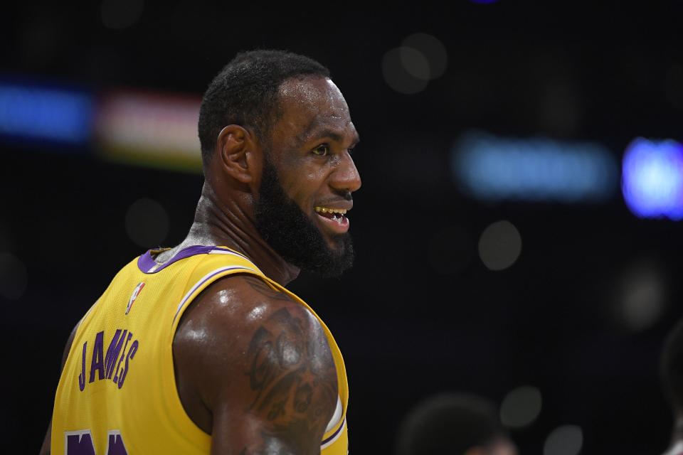 LeBron James in a Los Angeles Lakers jersey smiles. 