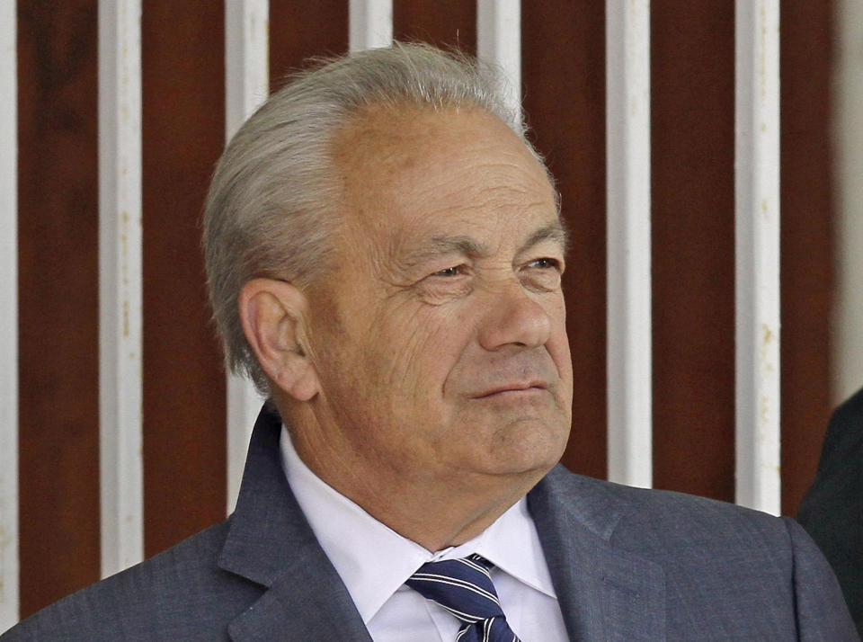 FILE - In this March 22, 2014, file photo, horse trainer Jerry Hollendorfer stands in the paddock at Turfway Park in Florence, Ky. Hollendorfer was banned by the ownership of Santa Anita on Saturday, June 22, 2019, after a fourth horse from his stable died--and the 30th overall--at the Southern California track. (AP Photo/Garry Jones, File)
