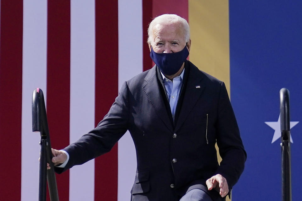 Democratic presidential candidate former Vice President Joe Biden step on stage to speak during a campaign event at Riverside High School in Durham, N.C., Sunday, Oct. 18, 2020. (AP Photo/Carolyn Kaster)