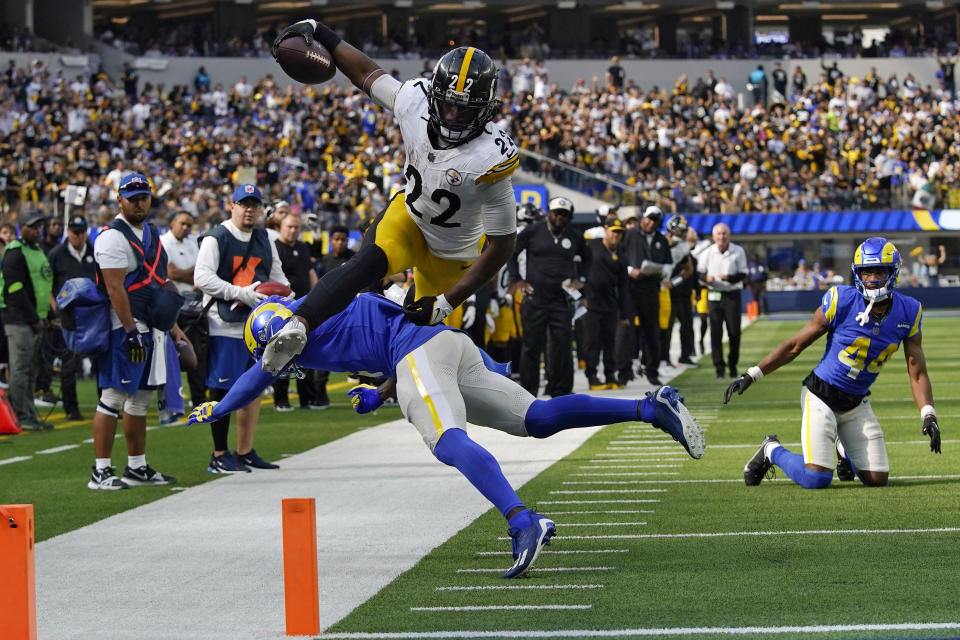 Pittsburgh Steelers running back Najee Harris, top, jumps over Los Angeles Rams safety Jordan Fuller during the second half of an NFL football game Sunday, Oct. 22, 2023, in Inglewood, Calif. (AP Photo/Gregory Bull)