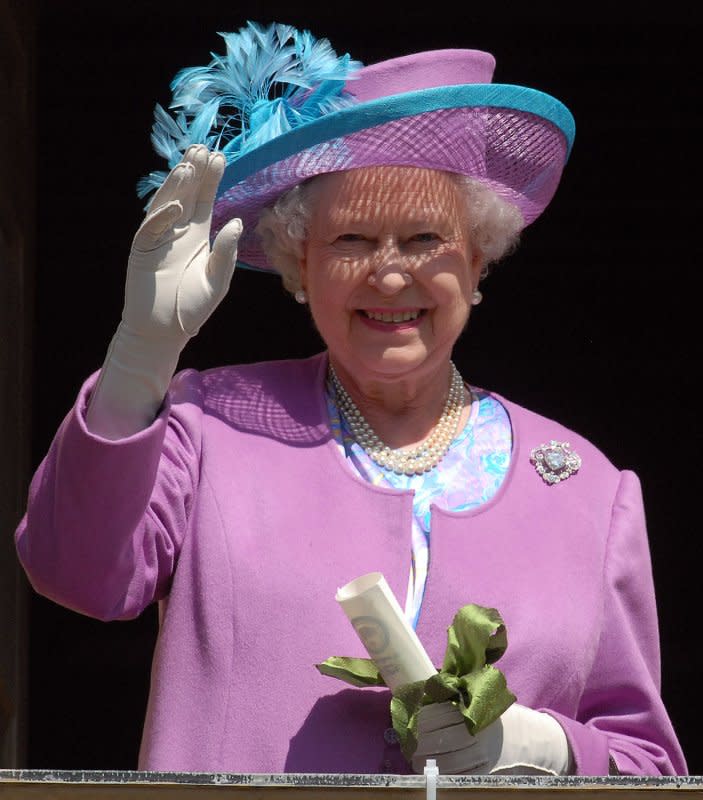 Britain's Queen Elizabeth II waves to guests gathered in the courtyard of the Wren building at the College of William and Mary in Williamsburg, Va., on May 4, 2007. On December 20, 2007, she became the oldest monarch in British history. File Photo by Roger L. Wollenberg/UPI
